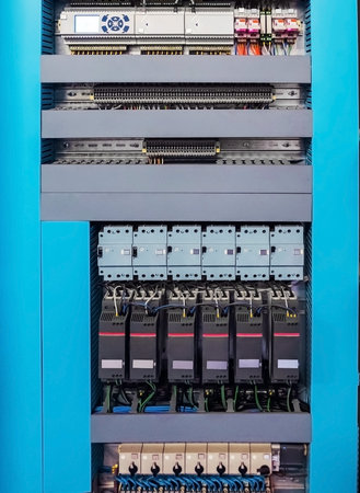 Low-voltage control box for HVAC system on the wall of the ventilation room