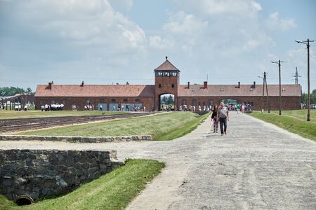 Auschwitz-Birkenau gate, railway road, touristsのeditorial素材