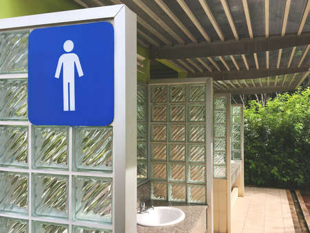 Blue Men Toilet Icon on a Sign. Public Restroom with a Male Symbol. Interior of Gas Station Terminal. Thailand.の写真素材