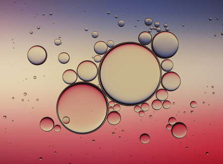 Oil Bubbles Isolated on White Background, Closeup Collagen Emulsion in Water. Illustration. Gold Droplets.の写真素材
