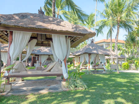 Resort loungers in the garden of Bali islandのeditorial素材