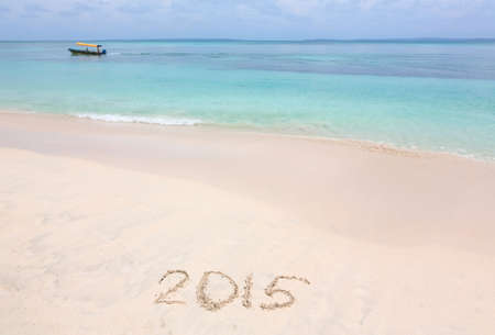 Year 2015 number written on sandy beachの写真素材