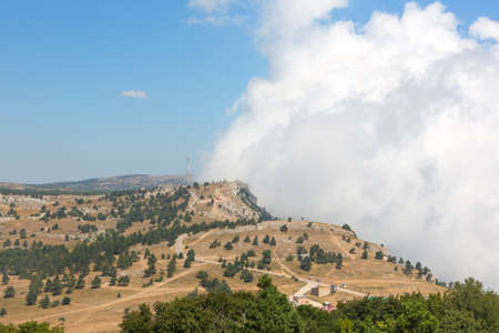 The wall of clouds at the edge of the cliffの写真素材
