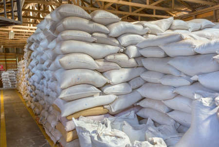 Stack of white bags at warehouseの写真素材