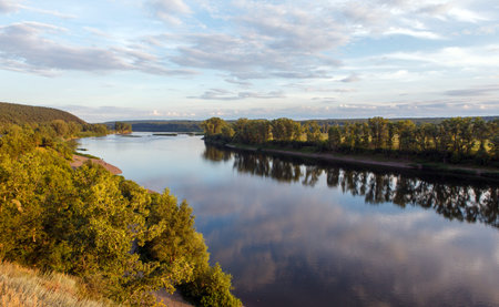 Wild forest and river with reflected clouds, siberia, russia