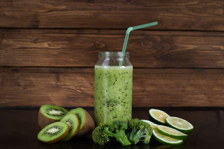 Smoothies of kiwi, Lemon and brokkele on a wooden backgroundの写真素材