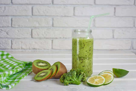 Smoothies of kiwi, Lemon and broccoli on a white backgroundの写真素材