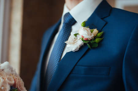 the groom in a blue suit with a tieの写真素材