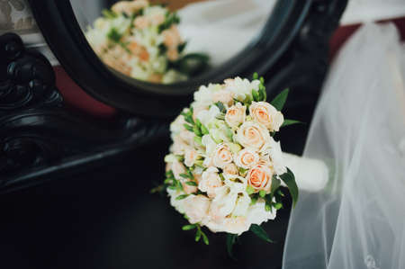 beautiful bridal bouquet lying on the tableの写真素材