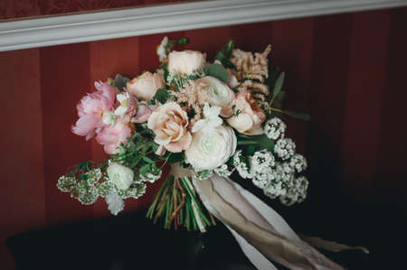 beautiful bridal bouquet lying on the tableの写真素材