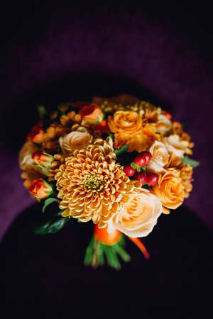 bridal bouquet of roses lying on the sofaの写真素材