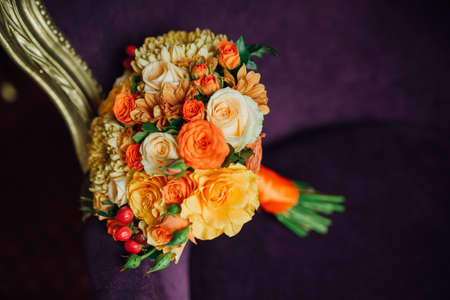 bridal bouquet of roses lying on the sofaの写真素材