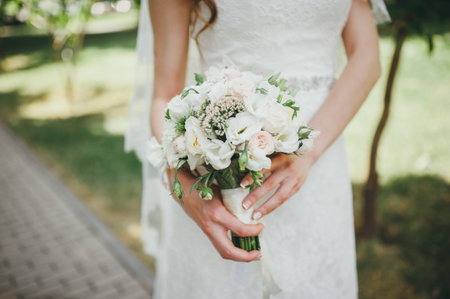 bridal bouquet in hands of the bride