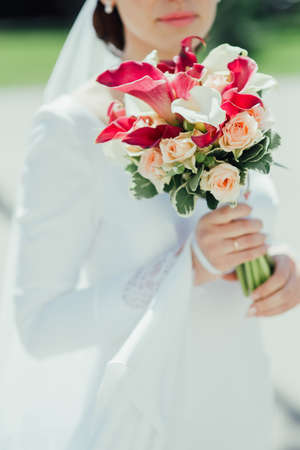 bridal bouquet in hands of the brideの写真素材