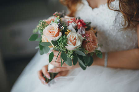bridal bouquet in hands of the brideの写真素材