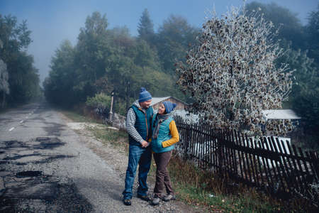 Tourists man and woman on a background of snow frost landscapeの写真素材
