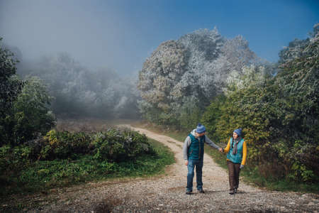 Tourists man and woman on a background of snow frost landscapeの写真素材