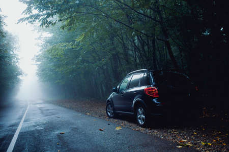 Car on the mountain road. The fog in the backgroundの写真素材