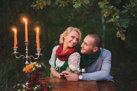 Romantic rendezvous of men and women in candlelightの写真素材