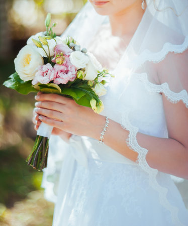 bridal bouquet in hands of the bride