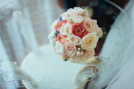 beautiful bridal bouquet lying on the tableの写真素材