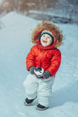 child on the background of the winter forestの写真素材
