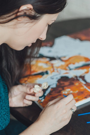 girl in a blue dress draws picture paintsの写真素材