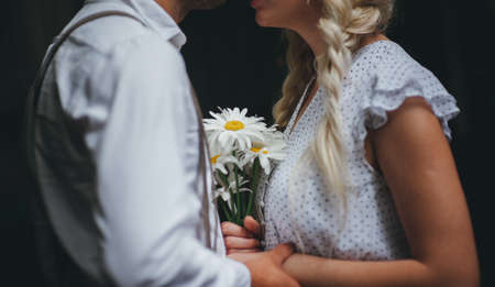 Boy and girl holding hands. Romantic love storyの写真素材