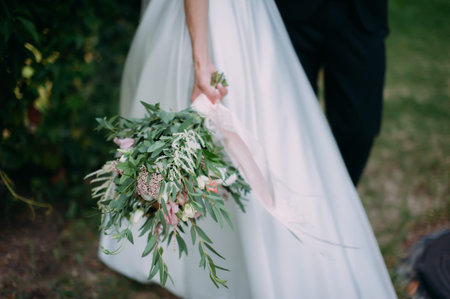 bridal bouquet in hands of the bride