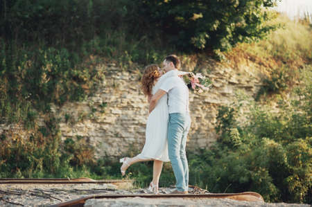 The bride and groom in nature. Rustic Weddingの写真素材
