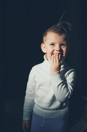 emotional child having fun on a dark background