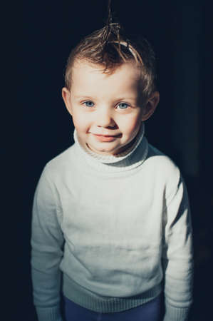 emotional child having fun on a dark backgroundの写真素材