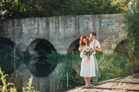 The bride and groom in nature. Rustic Weddingの写真素材