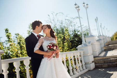 The bride and groom in autumn parkの写真素材