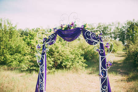 Wedding arch with fabrics and colors purpleの写真素材