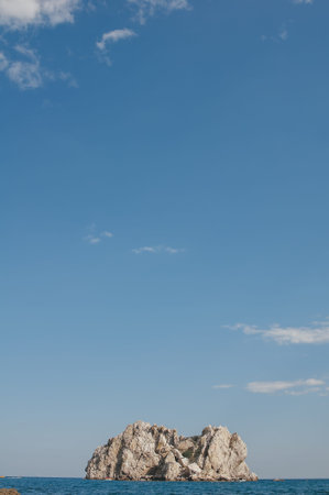 Rock on a background of blue sea. Beautiful seascapeの写真素材