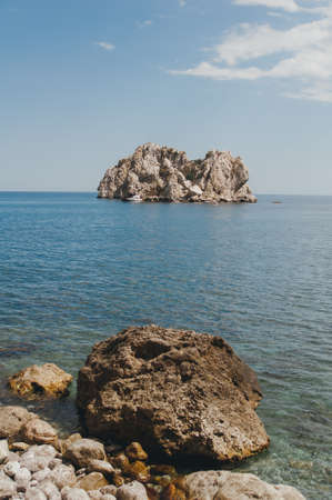 Rock on a background of blue sea. Beautiful seascapeの写真素材