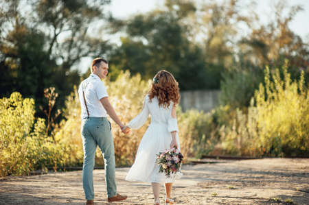 The bride and groom in nature. Rustic Weddingの写真素材