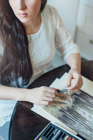 The girl in a beautiful white dress watercolor paints. Artistの写真素材