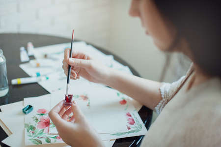 The girl in a beautiful white dress watercolor paints. Artistの写真素材