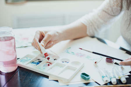 The girl in a beautiful white dress watercolor paints. Artistの写真素材