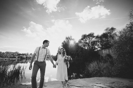 The bride and groom in nature. Rustic Weddingの写真素材