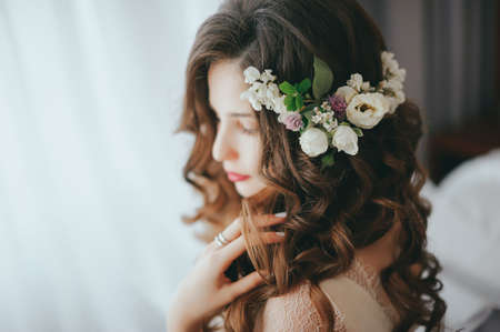 Luxury stylish bride sitting on the bedの写真素材