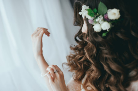 the bride wears a bracelet on hand