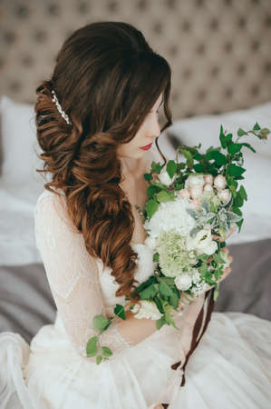Beautiful bride with fashion wedding hairstyle In a hotelの写真素材