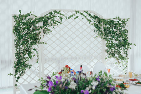 Beautiful wedding ceremony outdoors. Arch made of natural flowers. Decor
