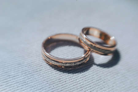 beautiful gold wedding rings on the brides preparationsの写真素材