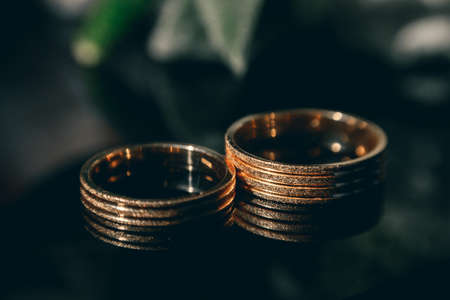 beautiful gold wedding rings on the brides preparationsの写真素材