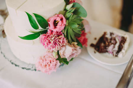 beautiful wedding cake with decorations and flowersの写真素材