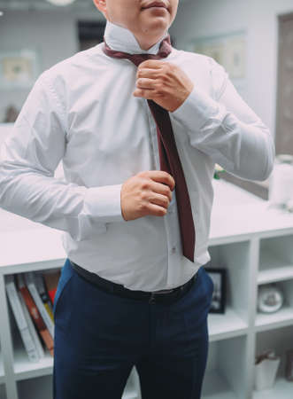 morning wedding preparations of a stylish groomの写真素材